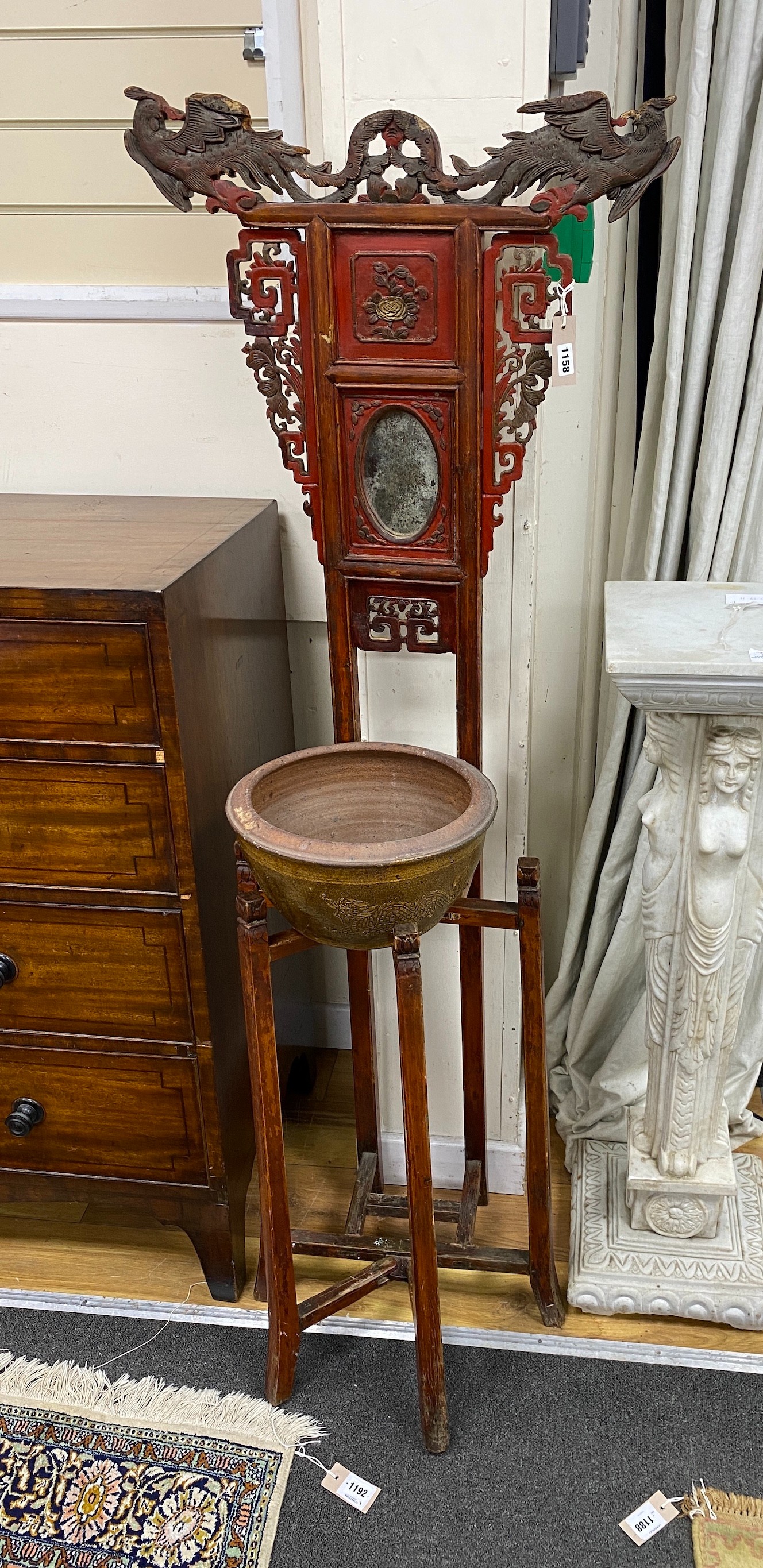 A late 19th century Chinese lacquered wood washstand, width 58cm, height 154cm and a later terracotta bowl